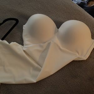 Shaping strapless bra slip.